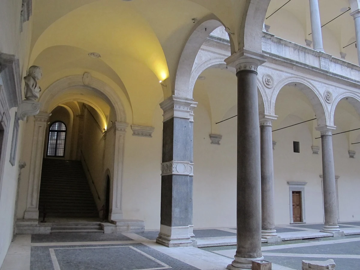 The arcades of the Cancelleria courtyard, how far ahead to book opera in rome